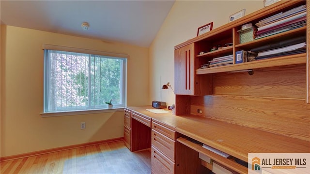 1141 Schmidt Ln, North Brunswick, NJ 08902 - unfurnished office with built in study area, light wood-style flooring, lofted ceiling, and baseboards