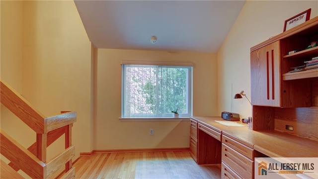 1141 Schmidt Ln, North Brunswick, NJ 08902 - office featuring built in study area, light wood finished floors, baseboards, and lofted ceiling