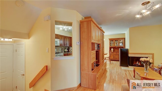 1141 Schmidt Ln, North Brunswick, NJ 08902 - hallway featuring light wood-style flooring and vaulted ceiling