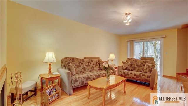 1141 Schmidt Ln, North Brunswick, NJ 08902 - living area featuring light wood-style flooring and baseboards