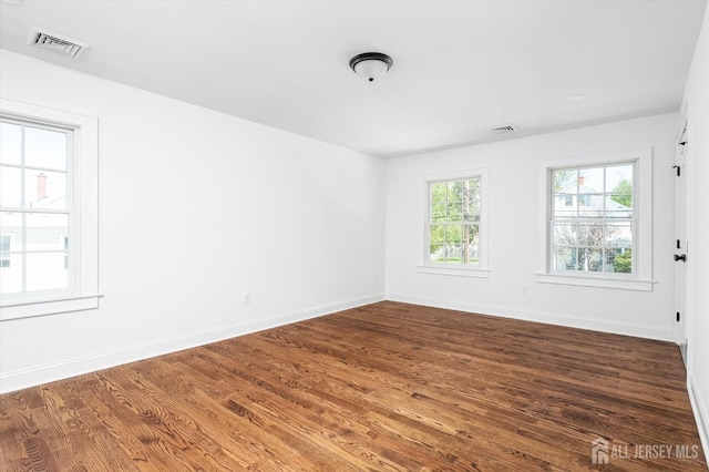440 Ellisdale Rd, Chesterfield, NJ 08515 - spare room with visible vents, baseboards, and dark wood-type flooring