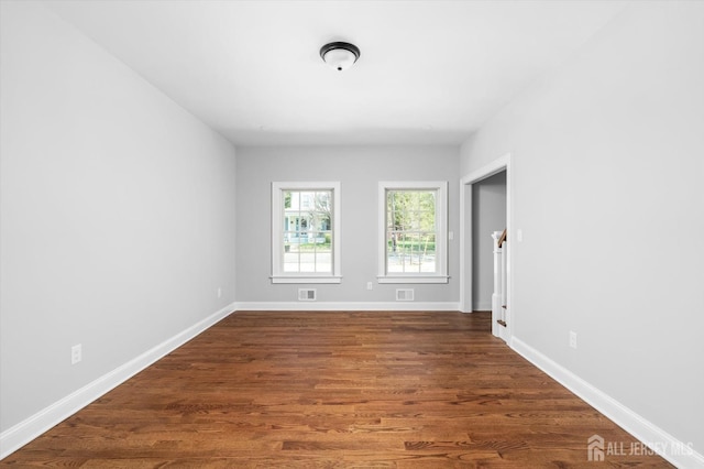 440 Ellisdale Rd, Chesterfield, NJ 08515 - unfurnished room with baseboards, dark wood-style flooring, and visible vents