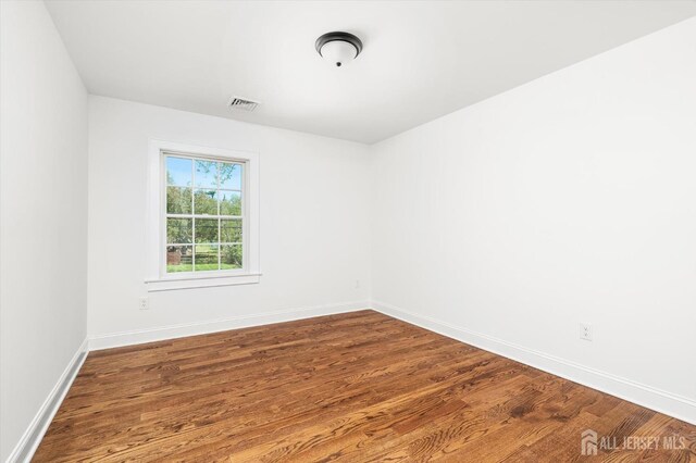 440 Ellisdale Rd, Chesterfield, NJ 08515 - spare room with baseboards, visible vents, and wood finished floors