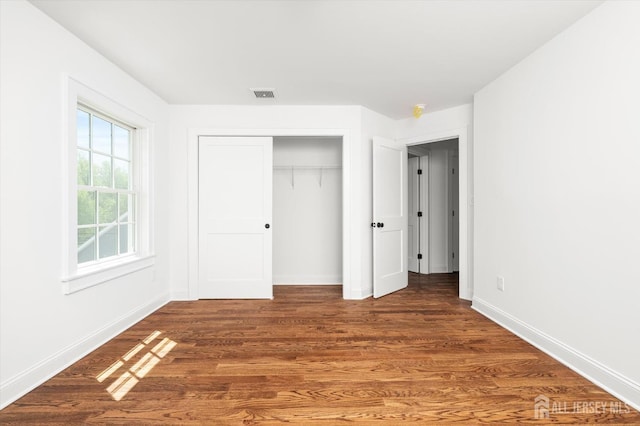 440 Ellisdale Rd, Chesterfield, NJ 08515 - unfurnished bedroom featuring baseboards, wood finished floors, and visible vents