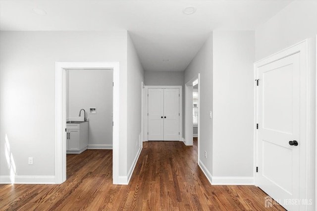 440 Ellisdale Rd, Chesterfield, NJ 08515 - hallway with baseboards, a sink, and wood finished floors