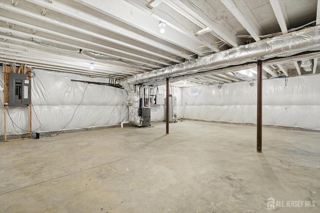 440 Ellisdale Rd, Chesterfield, NJ 08515 - unfinished basement featuring heating unit, water heater, and electric panel