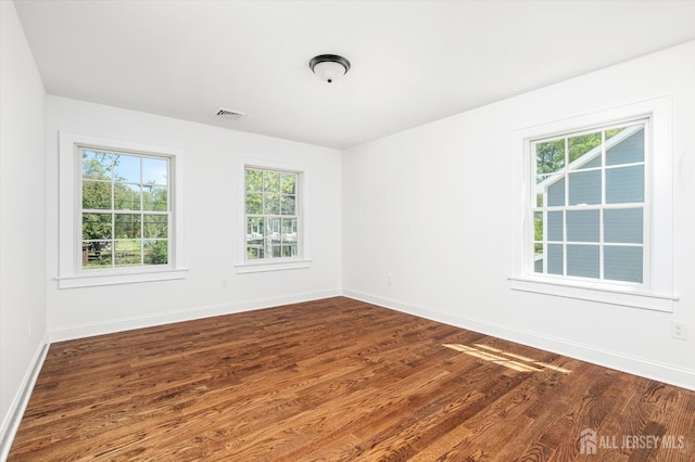 440 Ellisdale Rd, Chesterfield, NJ 08515 - spare room featuring baseboards, plenty of natural light, dark wood-style floors, and visible vents