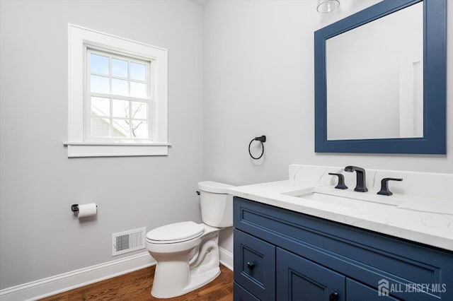 440 Ellisdale Rd, Chesterfield, NJ 08515 - bathroom featuring visible vents, wood finished floors, baseboards, vanity, and toilet