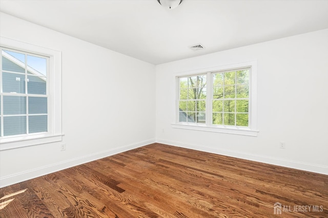 440 Ellisdale Rd, Chesterfield, NJ 08515 - empty room featuring dark wood-style flooring, baseboards, and visible vents
