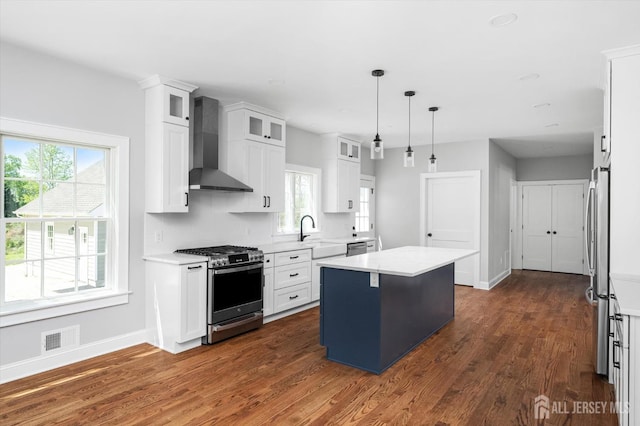 440 Ellisdale Rd, Chesterfield, NJ 08515 - kitchen featuring visible vents, appliances with stainless steel finishes, a center island, light countertops, and wall chimney exhaust hood