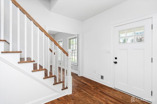 440 Ellisdale Rd, Chesterfield, NJ 08515 - foyer entrance with baseboards, dark wood-style flooring, stairs, and visible vents