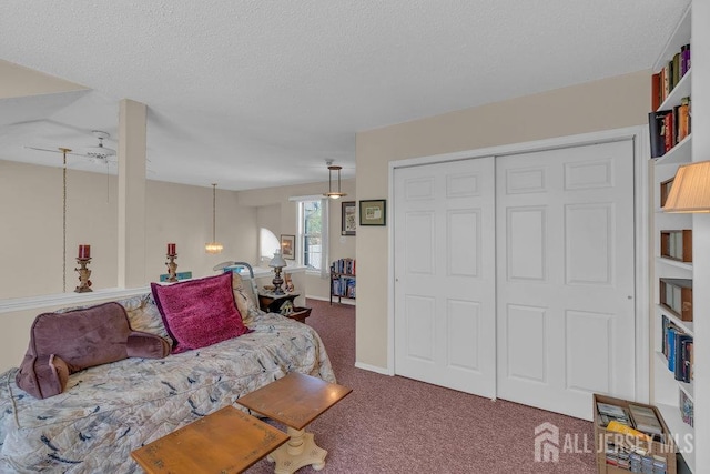 living room with an inviting chandelier, carpet floors, and a textured ceiling