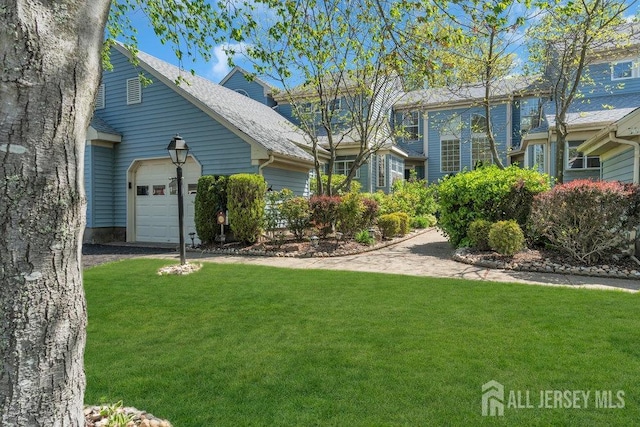 36 Canterbury Dr Unit D, Monroe, NJ 08831 - view of front of property with an attached garage, a front lawn, and driveway