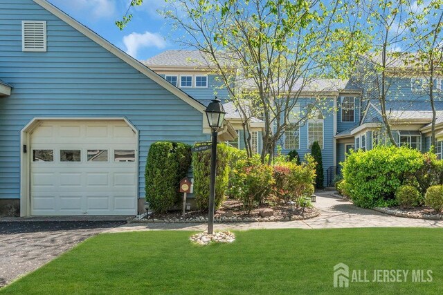 36 Canterbury Dr Unit D, Monroe, NJ 08831 - view of property exterior featuring a lawn