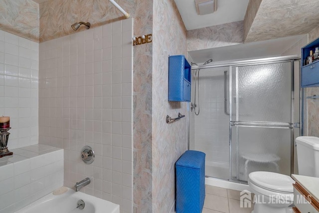 bathroom with shower / bath combination with glass door, tile patterned floors, toilet, and vanity