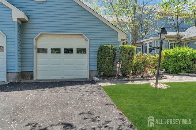 exterior space with aphalt driveway