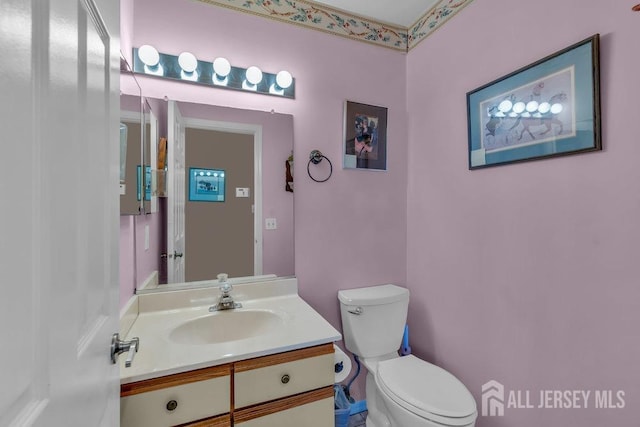 bathroom with vanity and toilet