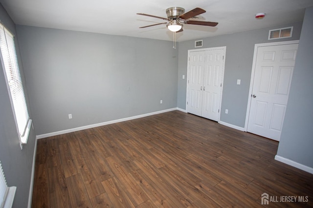 51 Shadyside Ave, Old Bridge, NJ 08879 - unfurnished bedroom with baseboards, visible vents, and dark wood-type flooring