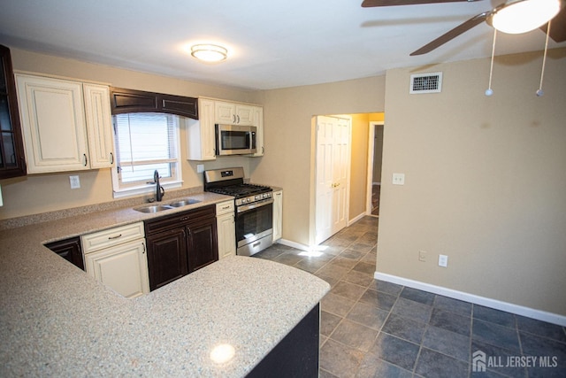 51 Shadyside Ave, Old Bridge, NJ 08879 - kitchen with ceiling fan, appliances with stainless steel finishes, a sink, baseboards, and visible vents
