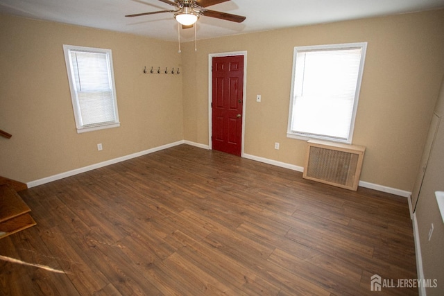 51 Shadyside Ave, Old Bridge, NJ 08879 - unfurnished living room featuring ceiling fan, baseboards, radiator, and dark wood-type flooring