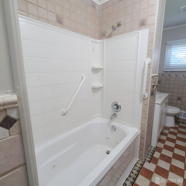 15 Clemson St, Old Bridge, NJ 08859 - bathroom featuring tile patterned floors, tile walls, crown molding, a combined bath / shower with jetted tub, and vanity