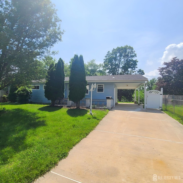 15 Clemson St, Old Bridge, NJ 08859 - view of front facade with concrete driveway, a carport, and a gate