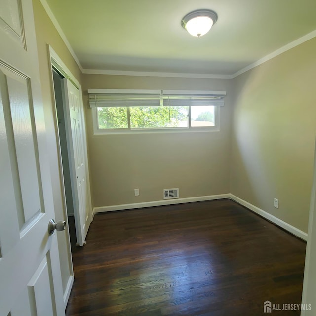15 Clemson St, Old Bridge, NJ 08859 - unfurnished bedroom with dark wood finished floors, multiple windows, crown molding, and a closet