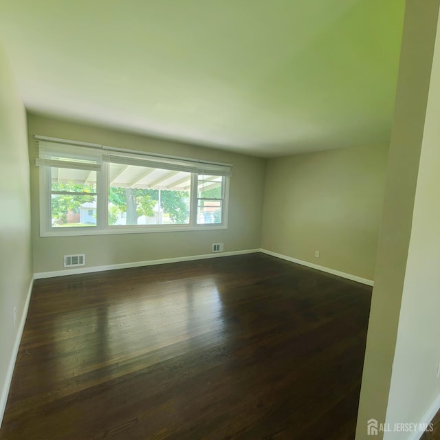 15 Clemson St, Old Bridge, NJ 08859 - unfurnished room with dark wood-type flooring and baseboards