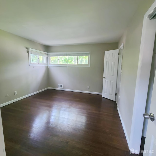 15 Clemson St, Old Bridge, NJ 08859 - unfurnished room featuring dark wood-style flooring and baseboards