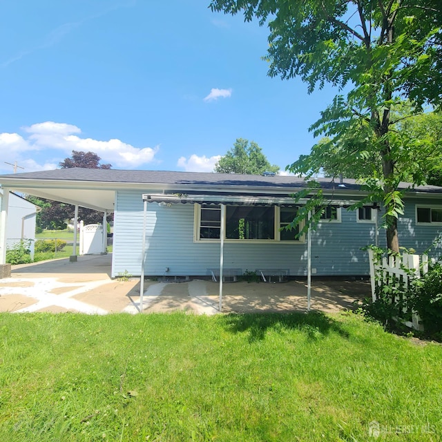 15 Clemson St, Old Bridge, NJ 08859 - back of property featuring a yard and a carport