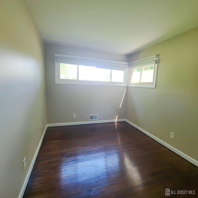 15 Clemson St, Old Bridge, NJ 08859 - spare room with wood finished floors and baseboards