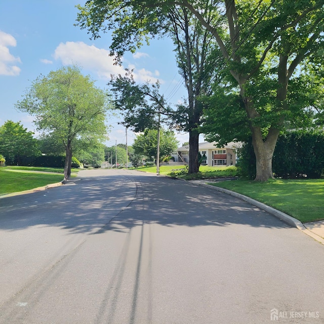15 Clemson St, Old Bridge, NJ 08859 - view of asphalt street featuring curbs