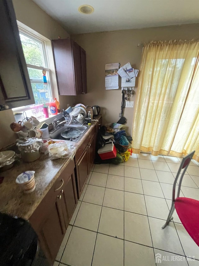 142 Joyce Kilmer Ave, New Brunswick, NJ 08901 - kitchen featuring a sink and light tile patterned floors