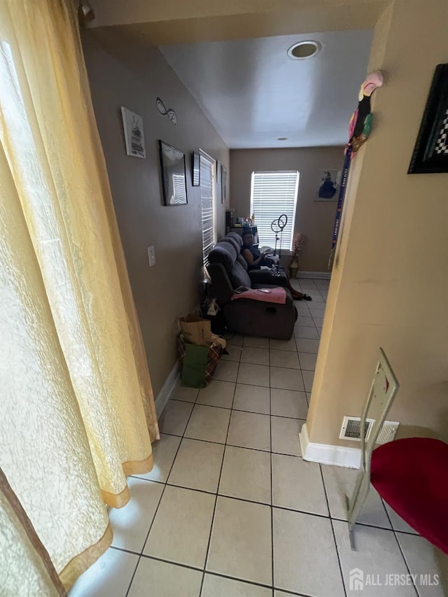 142 Joyce Kilmer Ave, New Brunswick, NJ 08901 - hallway with light tile patterned floors and baseboards