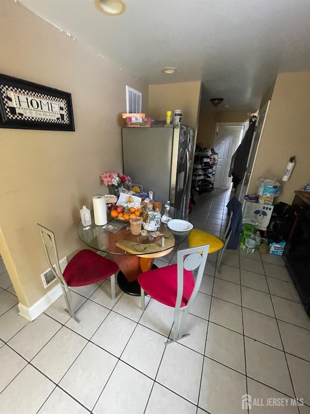 142 Joyce Kilmer Ave, New Brunswick, NJ 08901 - dining room featuring light tile patterned floors and baseboards