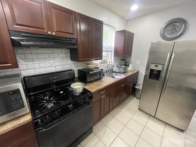 142 Joyce Kilmer Ave, New Brunswick, NJ 08901 - kitchen featuring under cabinet range hood, appliances with stainless steel finishes, a sink, tasteful backsplash, and light tile patterned flooring