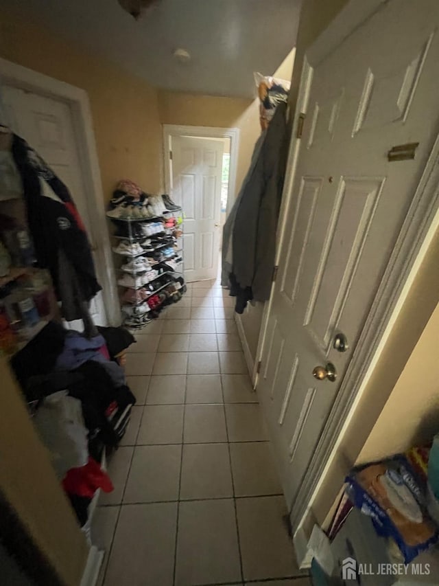 142 Joyce Kilmer Ave, New Brunswick, NJ 08901 - corridor with light tile patterned floors