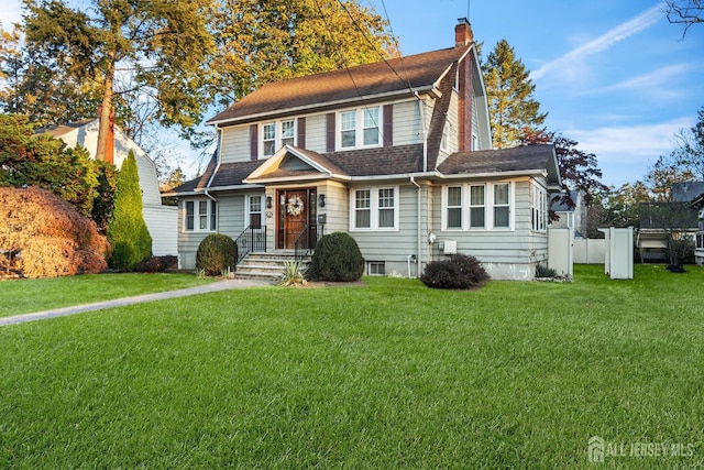 view of front of house with a front lawn