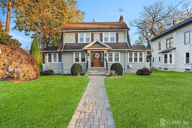 view of front of home with a front yard