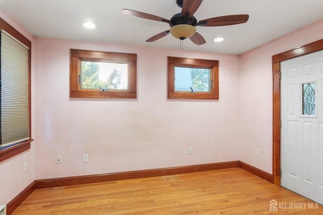 interior space with ceiling fan and light hardwood / wood-style floors