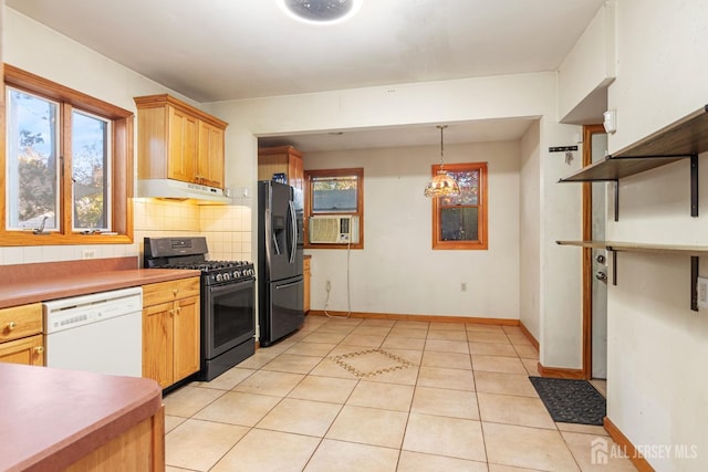 kitchen featuring an inviting chandelier, decorative light fixtures, decorative backsplash, light tile patterned floors, and black appliances