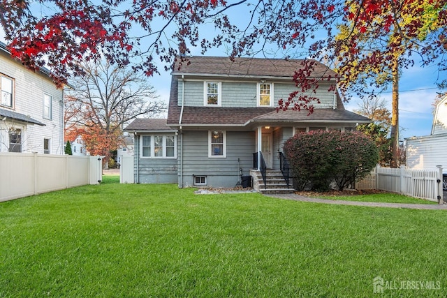 back of house with a yard