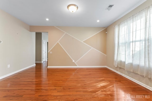 spare room featuring hardwood / wood-style flooring