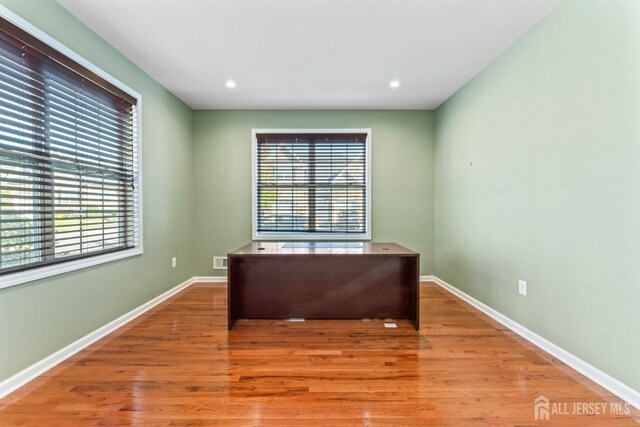 office area with wood-type flooring