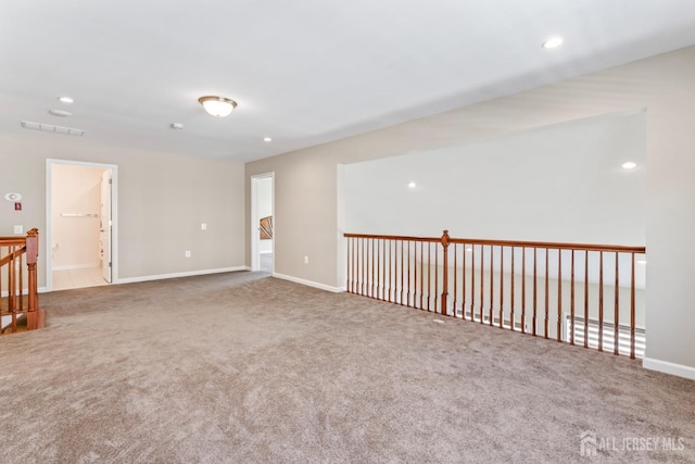 unfurnished room featuring carpet flooring