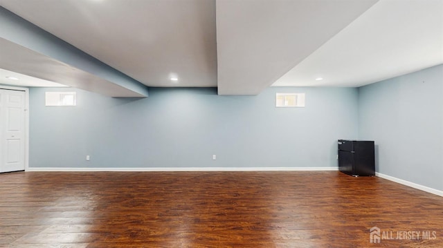 basement featuring dark hardwood / wood-style floors