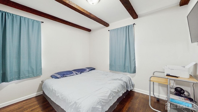 bedroom with dark hardwood / wood-style flooring and beam ceiling