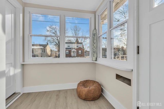 sitting room featuring wood finished floors and baseboards