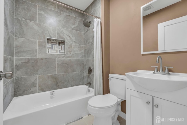 bathroom with vanity, visible vents, shower / tub combo, tile patterned floors, and toilet