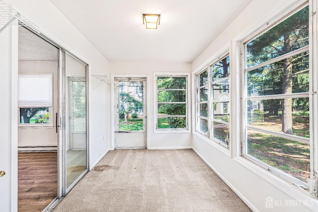 298-B Sharon Way, Monroe, NJ 08831 - unfurnished sunroom featuring a baseboard radiator and carpet